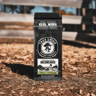 Bag of Backbreaker coffee featured in a farm scene.